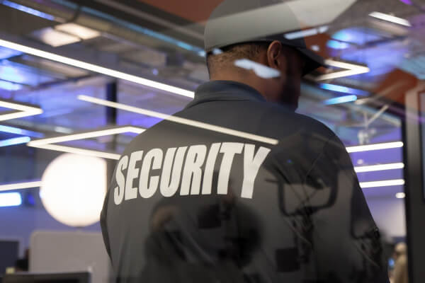 Concierge security guard assisting visitors at Ottawa building