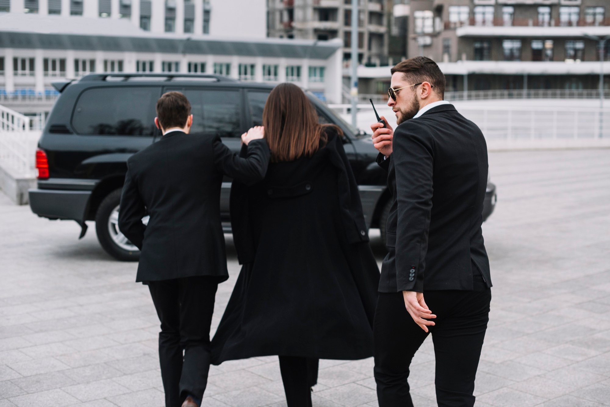 Security guard escorting VIP client at private event